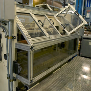 Bi-fold machine enclosure with one open window