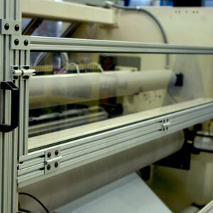 close up on silver aluminum frame with clear front panel and black handle