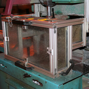 clear protective box with silver frame on teal stand