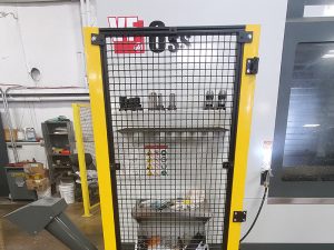 black gridded aluminum wall with yellow boarders