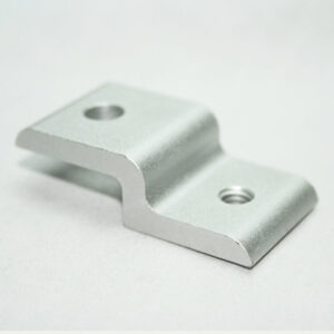 Silver metal L-shaped mounting bracket with two screw holes on a white surface.