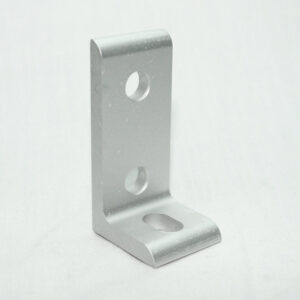 Silver metal L-bracket with two circular holes on the upright leg and a larger oval hole on the base, used for mounting or supporting a joint.