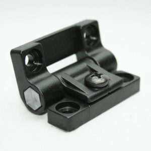 Black metal clamp-style mounting bracket with two base holes and a central screw, used to attach accessories