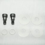 Two metal screws with ridged heads beside five white circular washers with central holes on a white background.