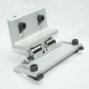 13AC7364_9__editedjpg | Faztek Industrial Solutions Metal hinge mounting bracket with rollers and a base plate on a white surface, ready for installation.