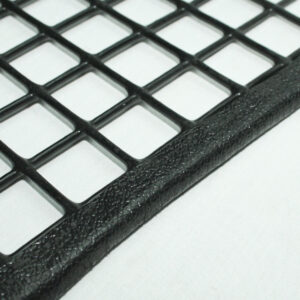 Close-up of a black textured grid with square openings.