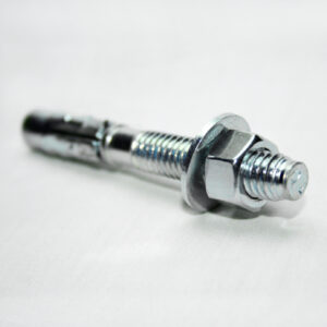Close-up of a shiny metal bolt with a washer and hex nut on a white surface.