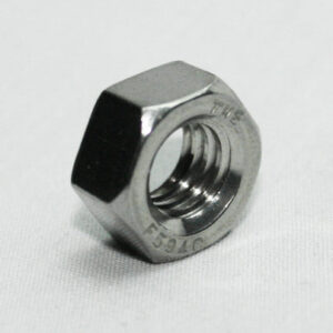 Metal hex nut on a white background, showing threaded inner hole and flat sides.