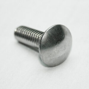 Metal bolt with a flat round head and threaded shaft lying on a white surface.