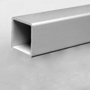 Close-up of a silver rectangular hollow metal tube with ribbed interior edges, resting on a light surface.