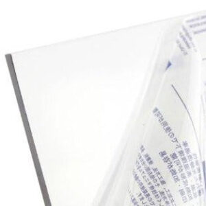 Close-up of a white folder partially wrapped in clear plastic, with printed text visible through the wrap.