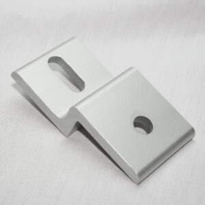 Metallic L-bracket with a circular hole in the base and a rectangular slot in the vertical arm.