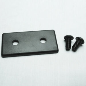 15AC7830_4__Editedjpg | Faztek Industrial Solutions Rectangular black plastic plate with two holes beside two black screws on a white surface.