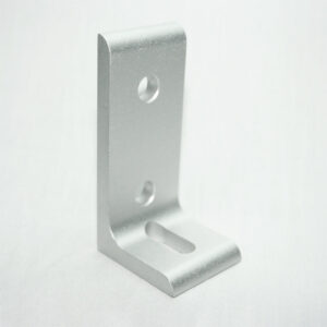 Silver metal L-shaped mounting bracket with two circular holes on the upright arm and a slotted hole on the base.