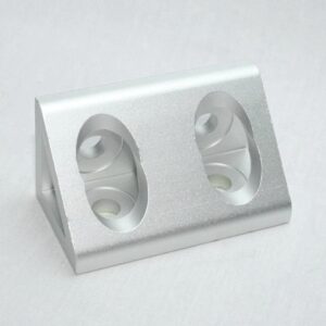 Silver double electrical outlet with two round sockets in a metal housing on a light background