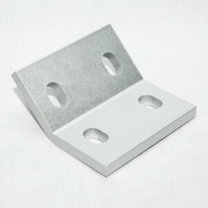 Silver metal L-bracket with four screw holes for mounting in an angle joint.
