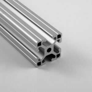 Aluminum T‑slot extrusion profile used for modular framing, showing multiple U-shaped channels onto a flat surface