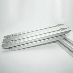Set of silver aluminum drawer slides stacked on a white background.