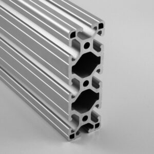 Three silver aluminum extrusion profiles with T-slot channels stacked together, used for modular framing systems.