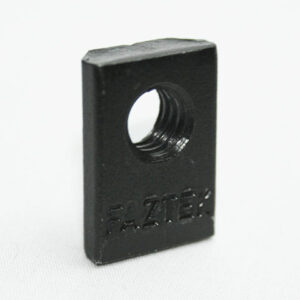 Black square nut with a central threaded hole on a white surface, photographed close-up.