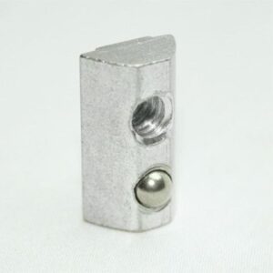 Small silver metal rectangular block with a threaded hole and a rounded ball on its side, on a white surface.