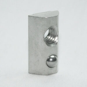Small silver metal block with a threaded hole and a rounded ball detent on its side.