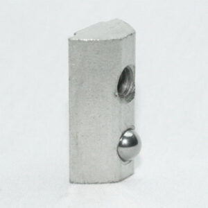 Small silver metal block with a rounded top, a threaded side hole, and a metal ball protruding from the front edge.