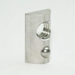 Silver metal hardware piece standing upright, with a threaded hole and a small ball on the front edge.