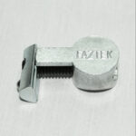 Silver Faztek cam lock lying on a light surface, showing the round head and serrated latch bolt