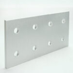 Rectangular silver aluminum plate with seven circular holes, standing on a white surface against a light background.