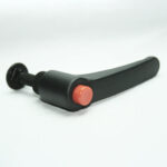 Ergonomic black lever with a pink push button at the tip and a threaded mount, likely a quick-release clamp accessory.