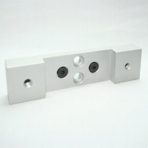 Silver aluminum mounting bracket with a central plate that has two recessed screws and two through-holes, flanked by square end blocks with through-holes each.