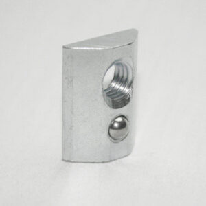 Metal curved rectangular block with a large threaded hole on the face and a small ball detent on the side.