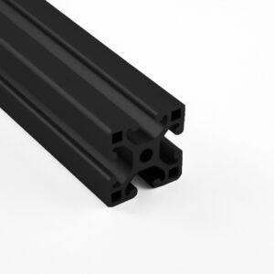 Close-up of a black anodized aluminum T-slot extrusion with multiple internal channels, used for modular framing.