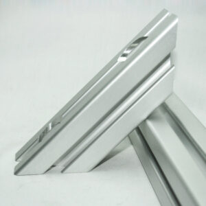 Close-up of a silver metal folding display easel standing on a flat surface.