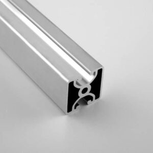 Aluminum extrusion rail with a black U-channel and white rubber gasket inside, viewed at an angle on a light surface