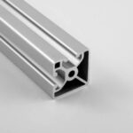 Silver aluminum extrusion/profile with T-slot channels (modular framing rail) typical for CNC machines or framing systems, shown in cross-section view.