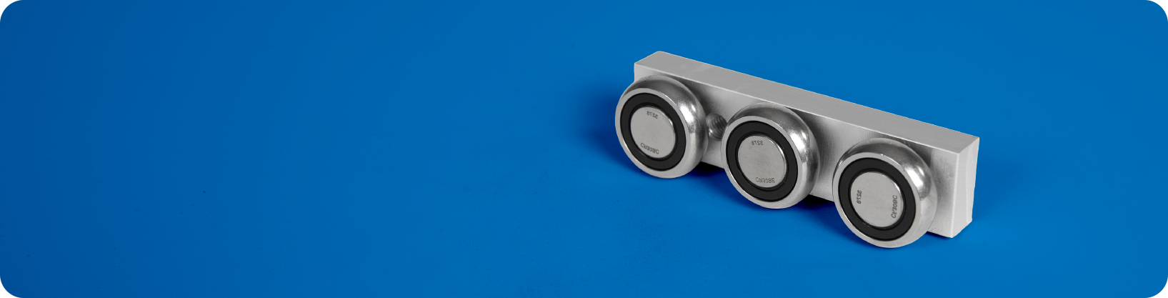 Linear motion component assembly for guided travel in Faztek framing systems.